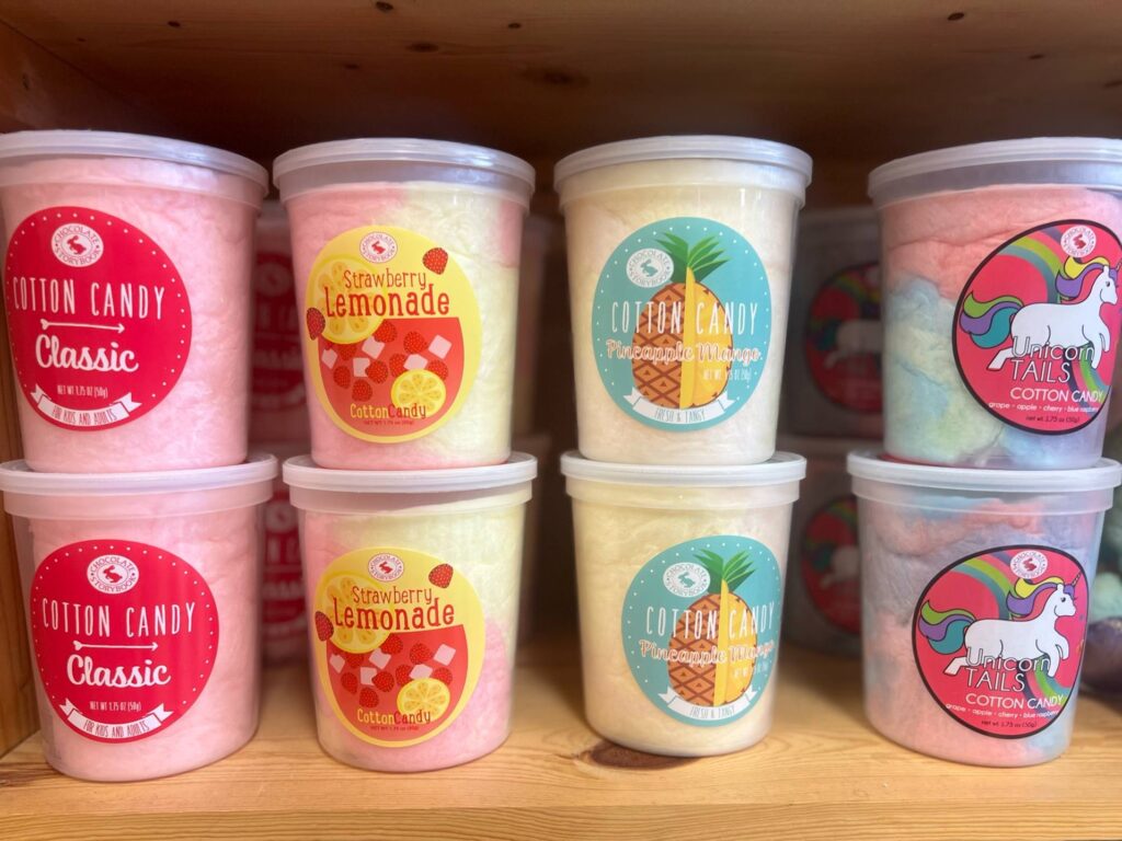 Tubs of cotton candy in fun flavors.